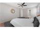 Bedroom with ceiling fan, carpet, and access to bathroom at 4704 Cheyenne Point Trl, Kissimmee, FL 34746