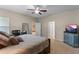 Bright bedroom with king-size bed and access to other rooms at 12348 Hammock Pointe Cir, Clermont, FL 34711