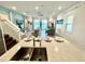 Open concept kitchen with island and stainless steel appliances at 8125 Surf St, Kissimmee, FL 34747