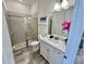 Modern bathroom with a walk-in shower and updated fixtures at 8125 Surf St, Kissimmee, FL 34747