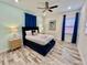 Spacious bedroom with a queen-size bed and en-suite bathroom at 8125 Surf St, Kissimmee, FL 34747