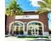 Brick building housing Sunnyside, an acai, sandwich, and smoothie cafe at 8125 Surf St, Kissimmee, FL 34747