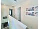Upstairs hallway with two bedrooms and bathroom access at 8125 Surf St, Kissimmee, FL 34747
