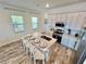 Modern kitchen with island, white cabinets, and stainless steel appliances at 8125 Surf St, Kissimmee, FL 34747