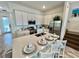 Modern kitchen with white cabinets, quartz countertops, and stainless steel appliances at 8125 Surf St, Kissimmee, FL 34747
