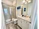 Bathroom with shower, toilet, vanity with quartz countertop at 8125 Surf St, Kissimmee, FL 34747