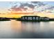 Lakefront community with sunset view and apartment buildings at 8125 Surf St, Kissimmee, FL 34747