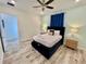 Cozy bedroom with a queen-size bed and plenty of natural light at 8125 Surf St, Kissimmee, FL 34747
