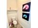 Powder room with decorative artwork and tile flooring at 8125 Surf St, Kissimmee, FL 34747