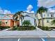 Two-story home with colorful exterior and landscaping at 8125 Surf St, Kissimmee, FL 34747