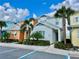 Two-story home with colorful exterior and landscaping at 8125 Surf St, Kissimmee, FL 34747