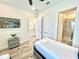 Bedroom with twin bed, private bathroom, and a view of the community at 8125 Surf St, Kissimmee, FL 34747