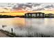 Community lake view at sunset with apartment buildings at 8125 Surf St, Kissimmee, FL 34747