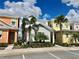 Two-story home with colorful exterior and landscaping at 8125 Surf St, Kissimmee, FL 34747