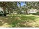 Community green space with large shade trees at 2444 Lobelia Dr, Lake Mary, FL 32746