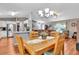 Dining room with a wooden table and chairs, and access to the kitchen at 10604 Se 146Th Ln, Summerfield, FL 34491
