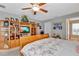 Main bedroom with king-size bed and built-in shelving at 10604 Se 146Th Ln, Summerfield, FL 34491