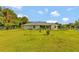 Large backyard with home and fenced area at 10604 Se 146Th Ln, Summerfield, FL 34491