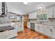 Modern kitchen with white cabinets, stainless steel appliances, and granite countertops at 10604 Se 146Th Ln, Summerfield, FL 34491