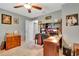Home office with a large desk, comfortable chair, and plenty of storage at 10604 Se 146Th Ln, Summerfield, FL 34491