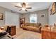 Multi-purpose room with comfortable couch and workspace at 10604 Se 146Th Ln, Summerfield, FL 34491