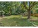 Spacious backyard with playset and lush landscaping at 233 S 4Th St, Lake Mary, FL 32746