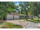Charming single-story home with a two-car garage and well-manicured lawn at 233 S 4Th St, Lake Mary, FL 32746