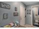 Small bathroom with toilet and shower, and decorative framed pictures on the wall at 233 S 4Th St, Lake Mary, FL 32746