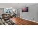 Spacious living area with hardwood floors and large windows at 233 S 4Th St, Lake Mary, FL 32746