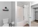 Bathroom with a tub, shower, and a toilet at 8110 Roseville Rd, Davenport, FL 33896