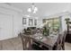 Bright dining room with seating for six and access to the backyard at 8110 Roseville Rd, Davenport, FL 33896
