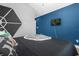bedroom with blue walls and a mounted TV at 8110 Roseville Rd, Davenport, FL 33896