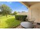 Private patio with table and chairs, overlooking a pond at 8110 Roseville Rd, Davenport, FL 33896