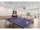 Game room with ping pong table and comfortable seating at 8110 Roseville Rd, Davenport, FL 33896
