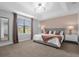 Spacious main bedroom with a king-size bed and neutral color palette at 8110 Roseville Rd, Davenport, FL 33896