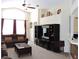 Bright living room featuring a large TV stand and comfortable seating at 320 Henley Cir, Davenport, FL 33896