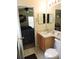 Bathroom with sink, vanity, toilet, and view of bedroom at 320 Henley Cir, Davenport, FL 33896