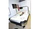 Air hockey table in a well-lit game room at 320 Henley Cir, Davenport, FL 33896