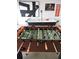 Foosball table in a well-lit game room at 320 Henley Cir, Davenport, FL 33896