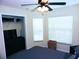 Well-lit bedroom with large windows and a ceiling fan at 320 Henley Cir, Davenport, FL 33896