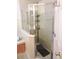 Large walk-in shower with glass enclosure and multiple shower heads at 320 Henley Cir, Davenport, FL 33896