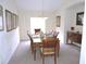 Formal dining room with wood table and chairs at 320 Henley Cir, Davenport, FL 33896