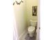 Small half bathroom with toilet and pedestal sink at 320 Henley Cir, Davenport, FL 33896