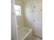 Bathroom with tub, shower, and tile surround at 320 Henley Cir, Davenport, FL 33896