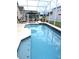 Refreshing screened pool perfect for relaxation and entertainment at 320 Henley Cir, Davenport, FL 33896