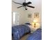 Two twin beds, nightstand, and a door to a bathroom at 320 Henley Cir, Davenport, FL 33896