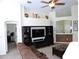 Open living room with built-in entertainment center at 320 Henley Cir, Davenport, FL 33896