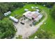 Aerial view of a property with multiple buildings and equipment at 2341 Celery Ave, Sanford, FL 32771