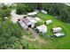 Aerial view of a property featuring a metal workshop and various storage units at 2341 Celery Ave, Sanford, FL 32771