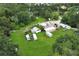 Aerial view showcasing a workshop and surrounding land, near residential homes at 2341 Celery Ave, Sanford, FL 32771